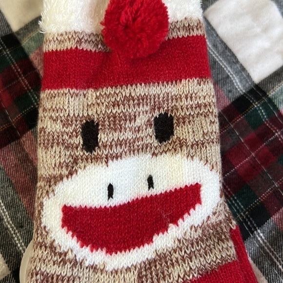 The sock monkey has rubber on the bottom for slip resistant. - Picture 4 of 8
